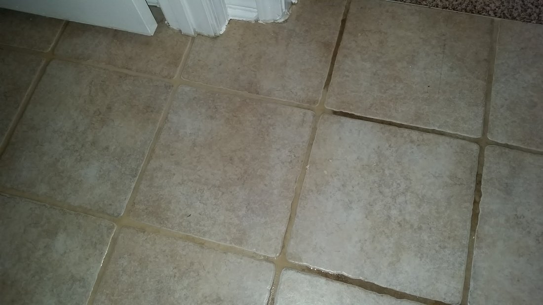 Picture of tile and grout cleaning during the cleaning process by Absolutely Kleen of Daphne, AL.