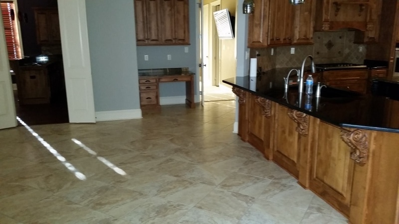 Picture of tile and grout cleaning in the kitchen / living area in Spanish Fort by Absolutely Kleen